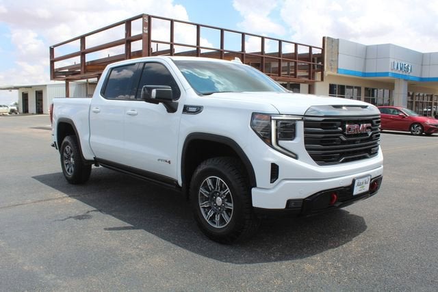 2024 GMC Sierra 1500 AT4 in Summit White — front three-quarter view